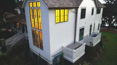 side view of white house with propane generator